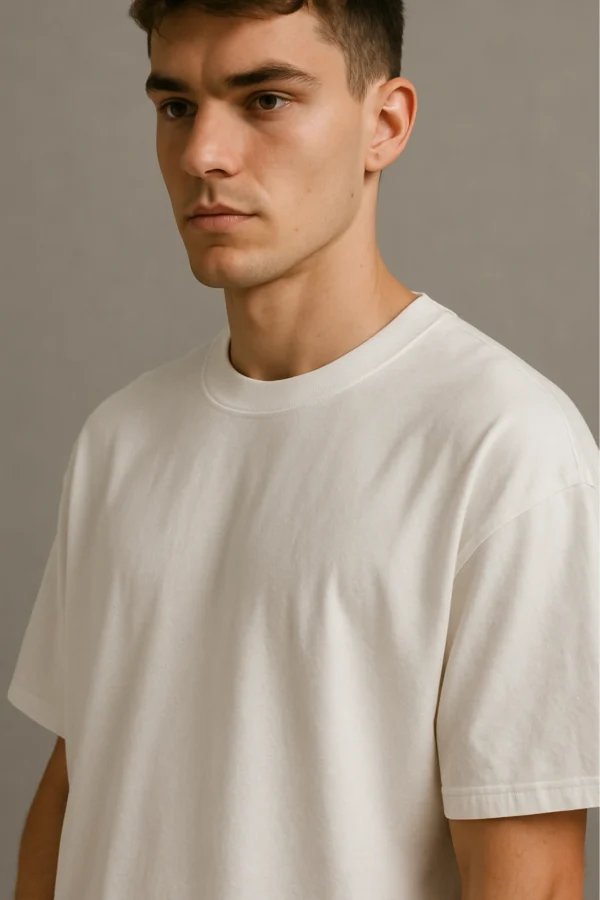 Resillie8 White Men’s Oversized T-shirt featuring a relaxed fit, ribbed neckline, dropped shoulders, and straight-cut hem, made from a soft cotton-polyester blend for ultimate comfort and casual style.