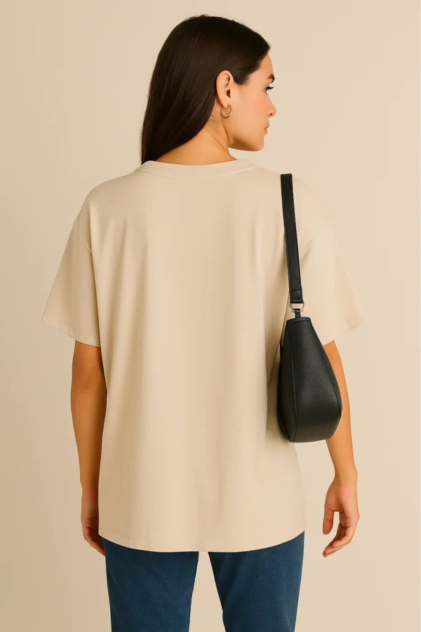 Resillie8 White Women’s Oversized T-shirt featuring a relaxed fit with dropped shoulders, ribbed neckline, and straight-cut hem, made from a soft cotton-polyester blend for breathable comfort and casual style.
