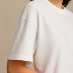 Resillie8 White Women’s Oversized T-Shirt featuring soft cotton-polyester fabric, relaxed dropped shoulders, ribbed crew neckline, and straight-cut hem—designed for breathable comfort and casual-chic style.