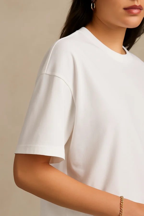 Resillie8 White Women’s Oversized T-Shirt featuring soft cotton-polyester fabric, relaxed dropped shoulders, ribbed crew neckline, and straight-cut hem—designed for breathable comfort and casual-chic style.