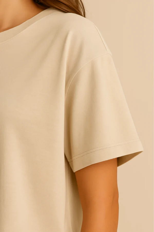 Resillie8 White Women’s Oversized T-shirt featuring a relaxed fit with dropped shoulders, ribbed neckline, and straight-cut hem, made from a soft cotton-polyester blend for breathable comfort and casual style.