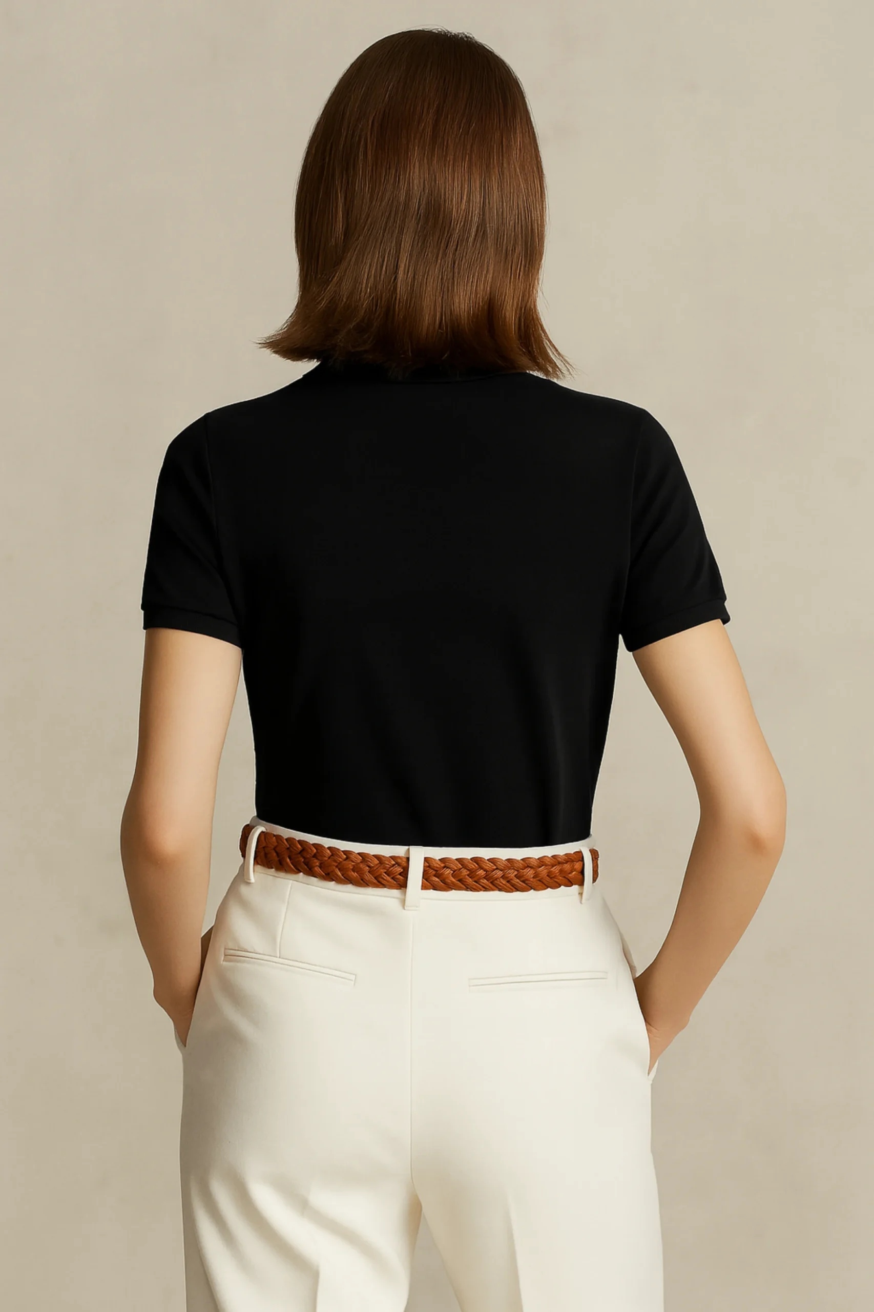 Black polo t-shirt made from premium cotton blend double piqué fabric with short sleeves, buttoned collar, and regular fit