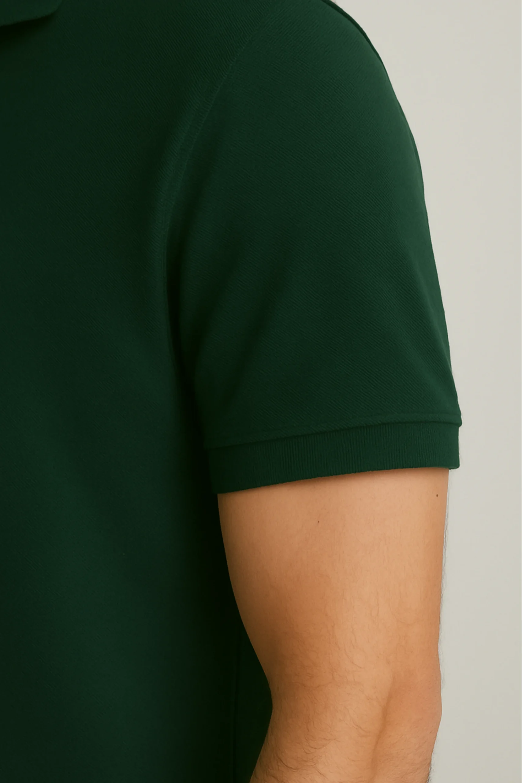 Dark green polo t-shirt crafted from premium cotton blend double piqué fabric with short sleeves, buttoned collar, and regular fit.