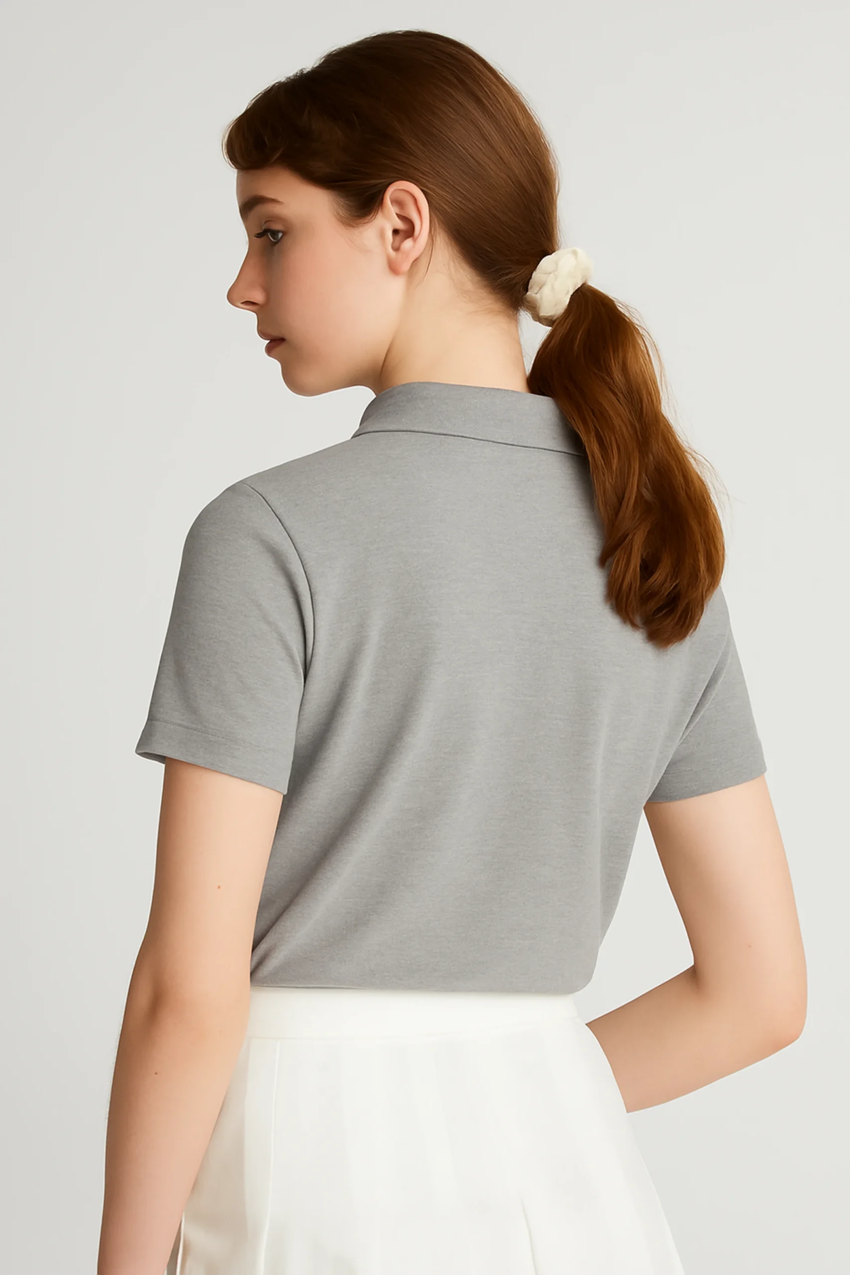 Grey polo t-shirt crafted from premium cotton blend double piqué fabric with short sleeves, buttoned collar, and regular fit.