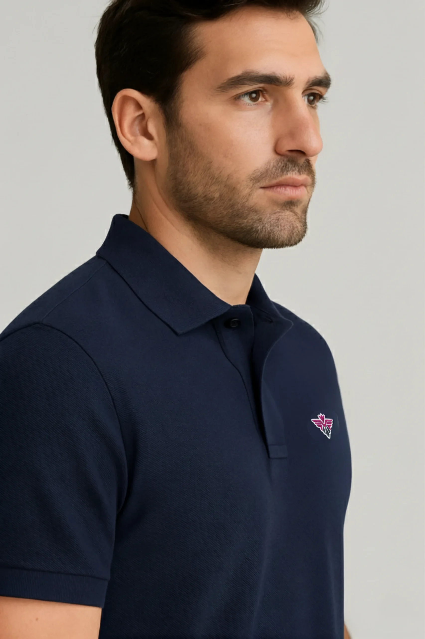 Navy blue polo t-shirt made from premium cotton blend double piqué fabric with short sleeves, buttoned collar, and classic regular fit