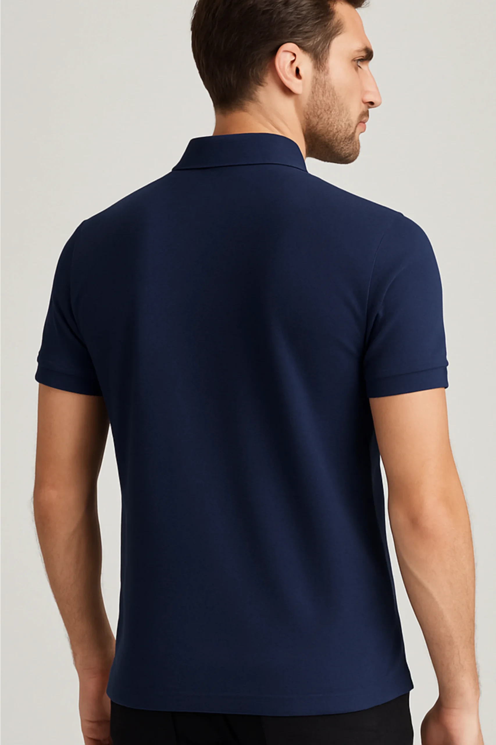 Navy blue polo t-shirt made from premium cotton blend double piqué fabric with short sleeves, buttoned collar, and classic regular fit