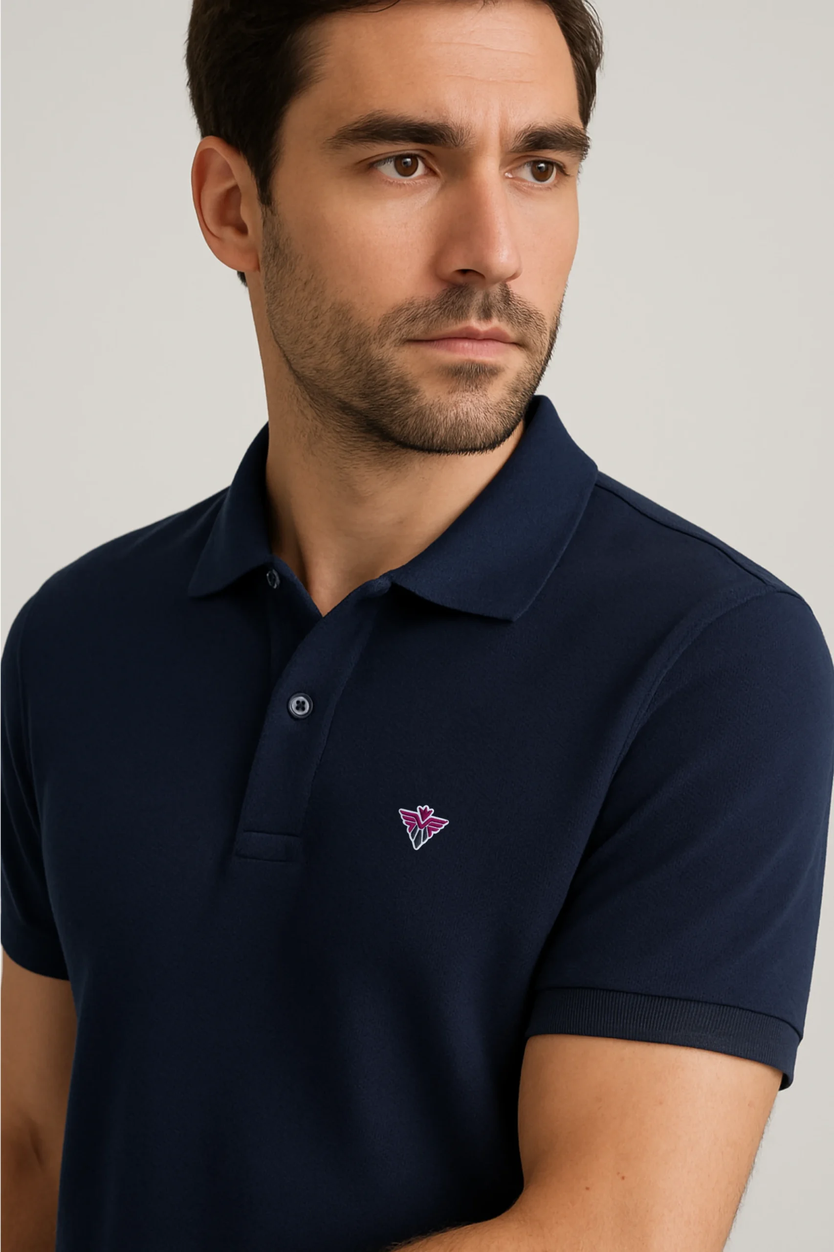Navy blue polo t-shirt made from premium cotton blend double piqué fabric with short sleeves, buttoned collar, and classic regular fit