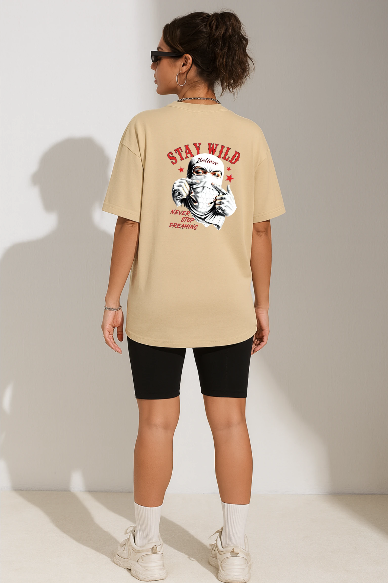 Stay Wild oversized t-shirt made from premium 240 GSM French Terry fabric, 52% cotton and 48% polyester blend, with bold graphic and relaxed fit