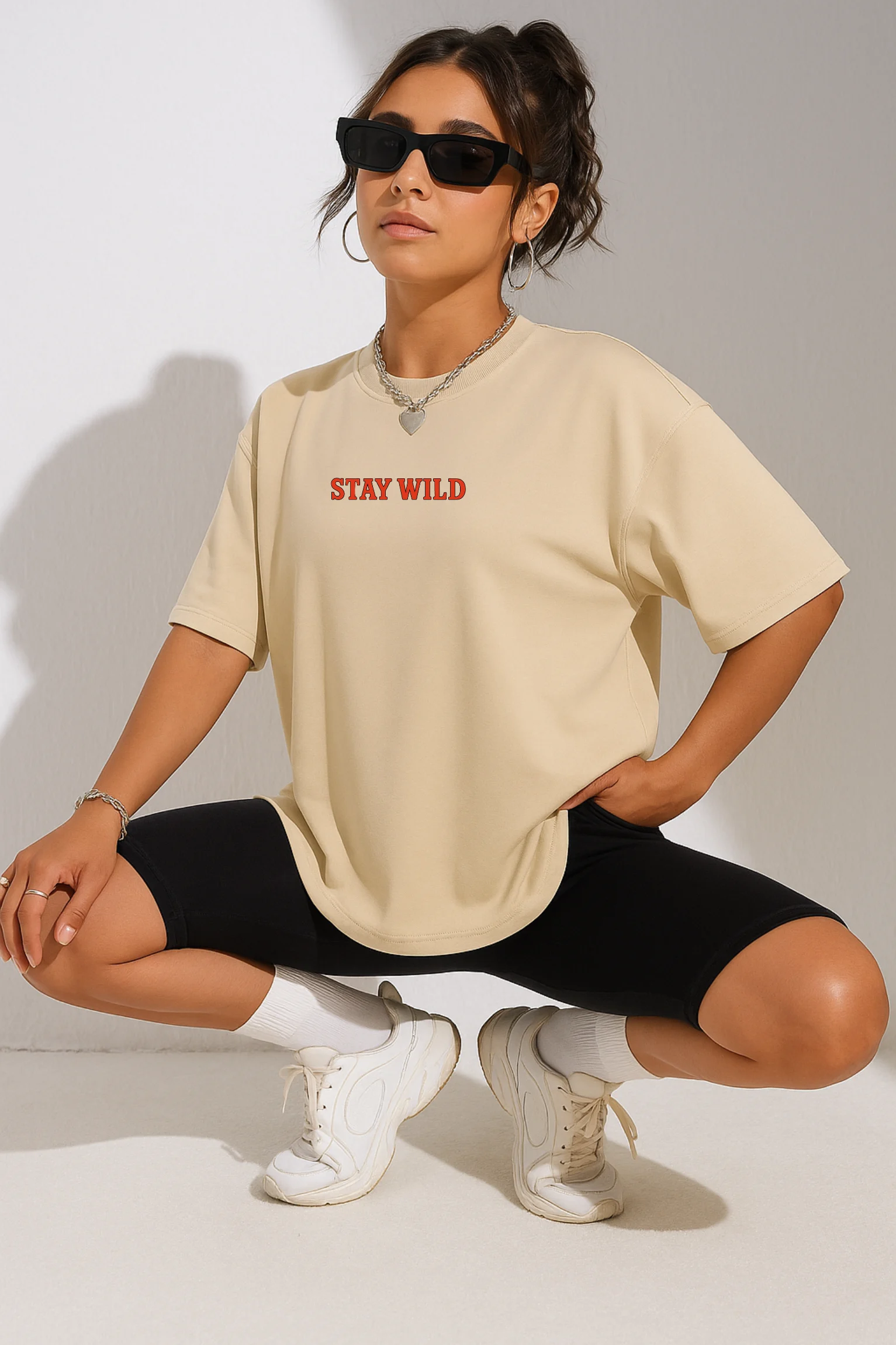 Stay Wild oversized t-shirt made from premium 240 GSM French Terry fabric, 52% cotton and 48% polyester blend, with bold graphic and relaxed fit